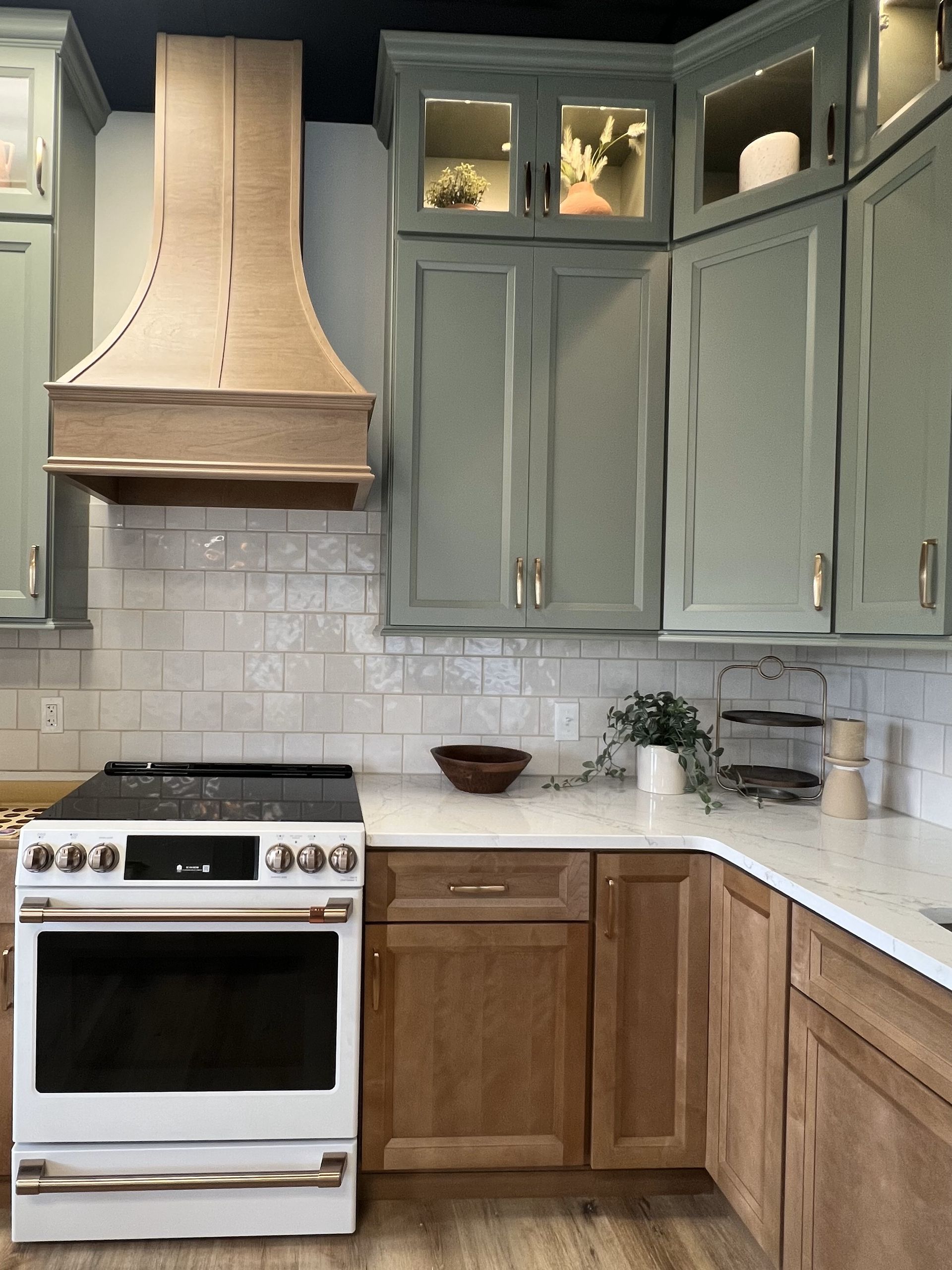 A living room with a dining table and chairs and a kitchen.