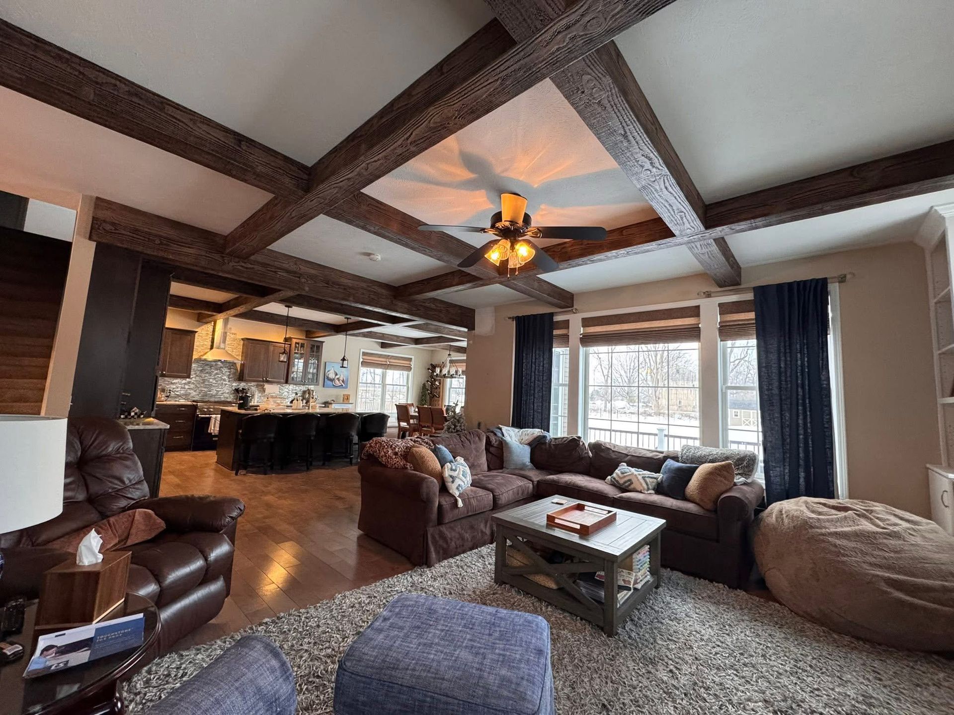A living room with a couch , coffee table , and rug.