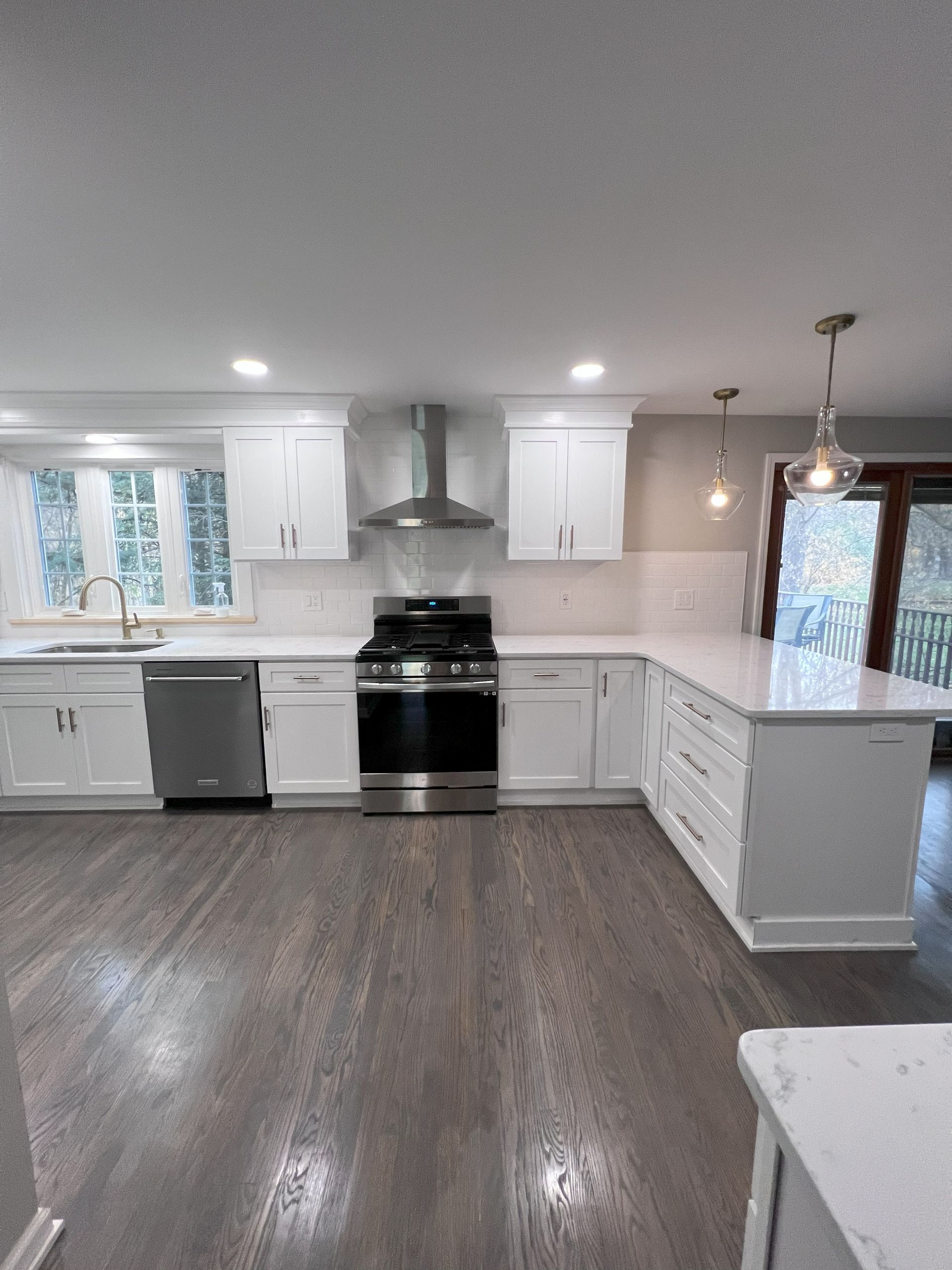 A kitchen with a yellow stove and a pink refrigerator