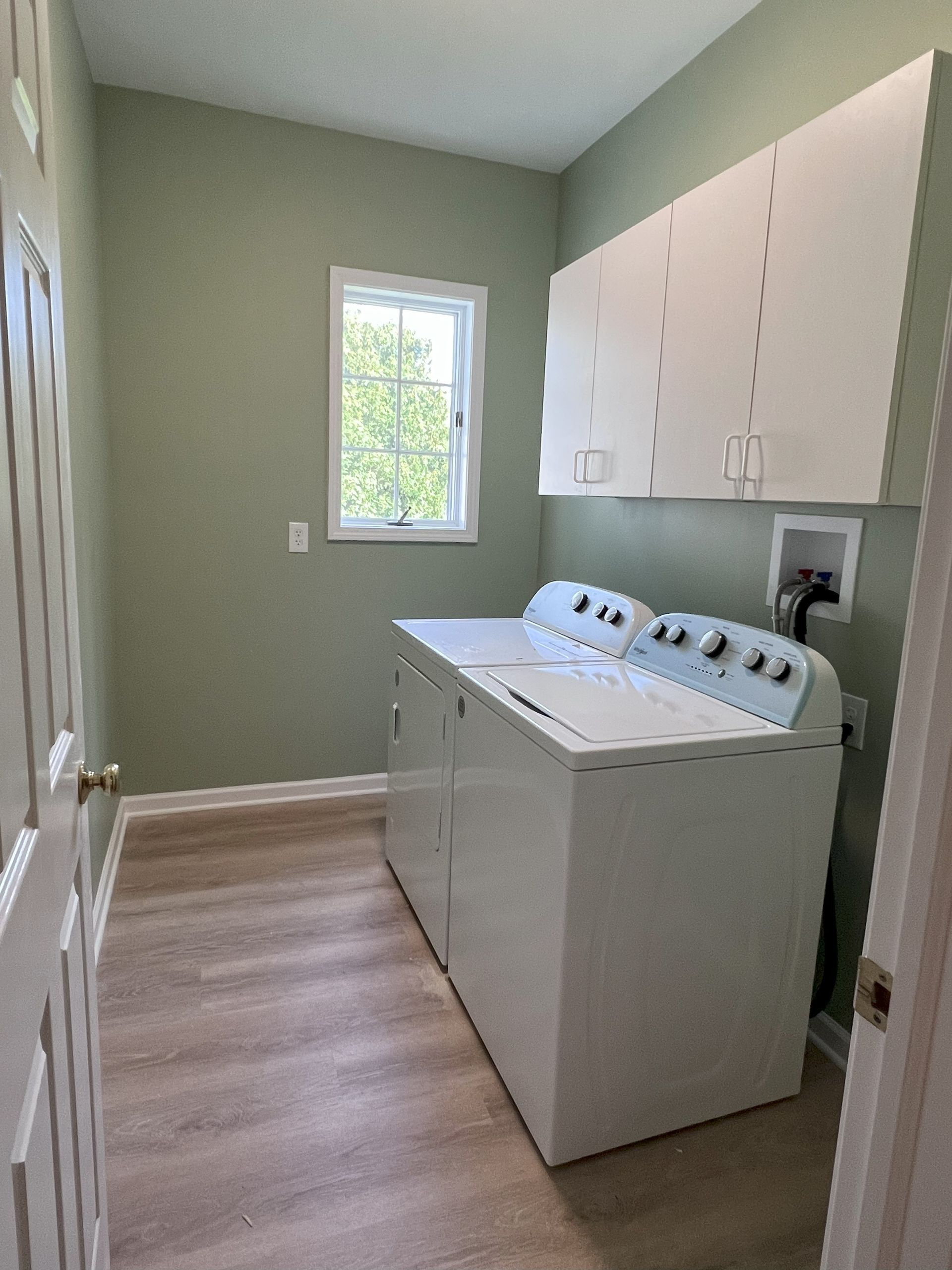 A living room with a couch , coffee table , and rug.