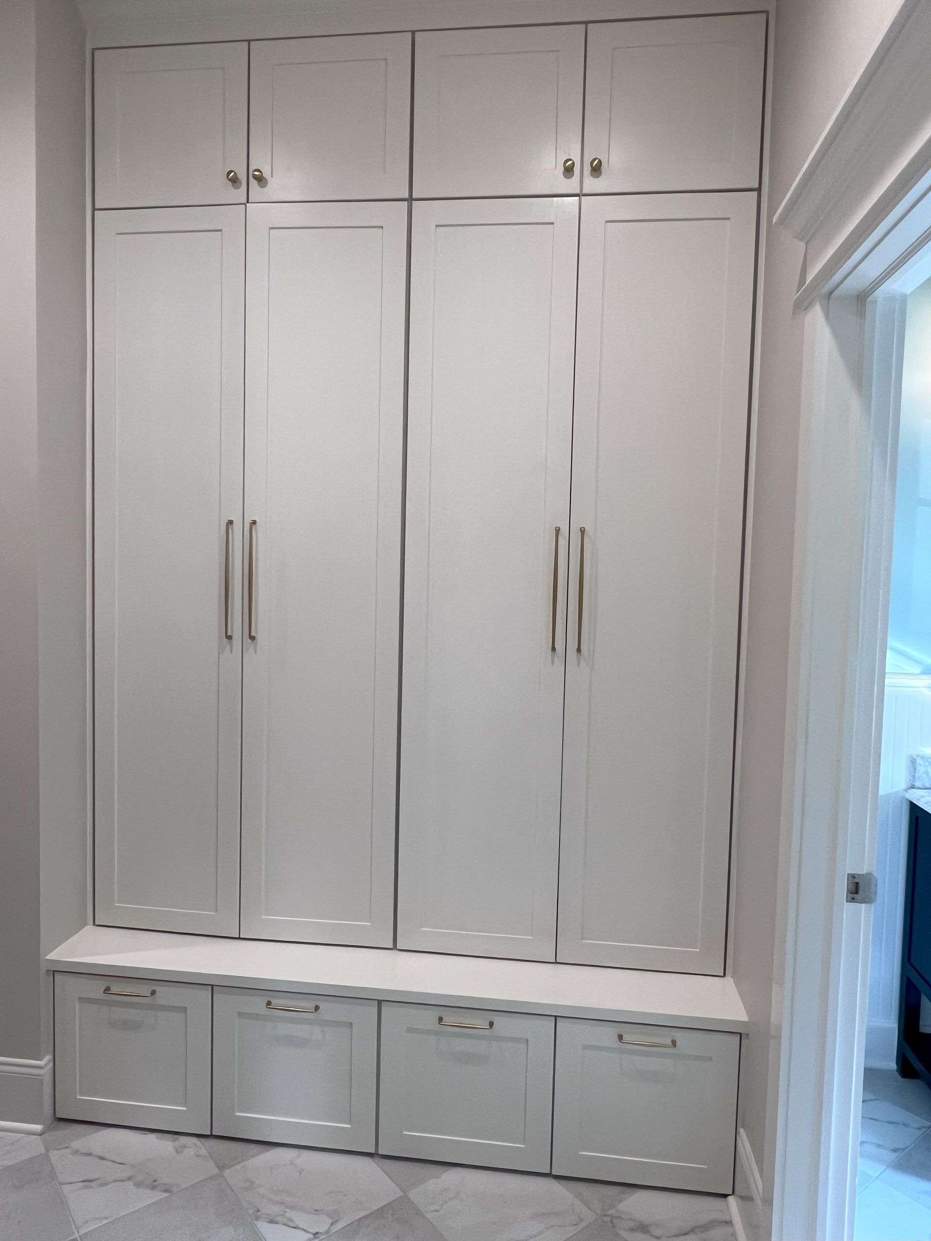 A living room with a couch , coffee table , fireplace and a painting on the wall.