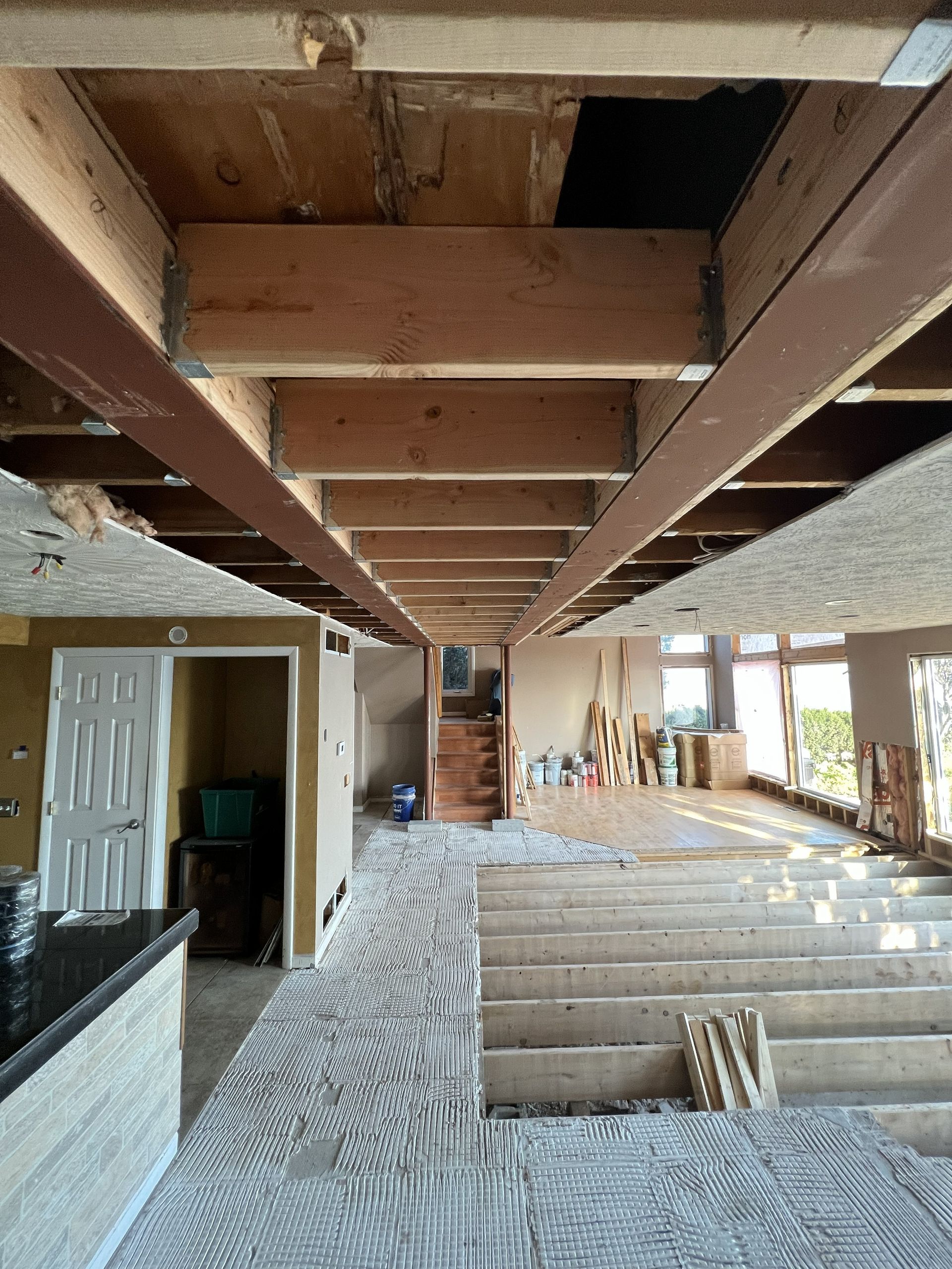 A living room with a large flat screen tv on the wall