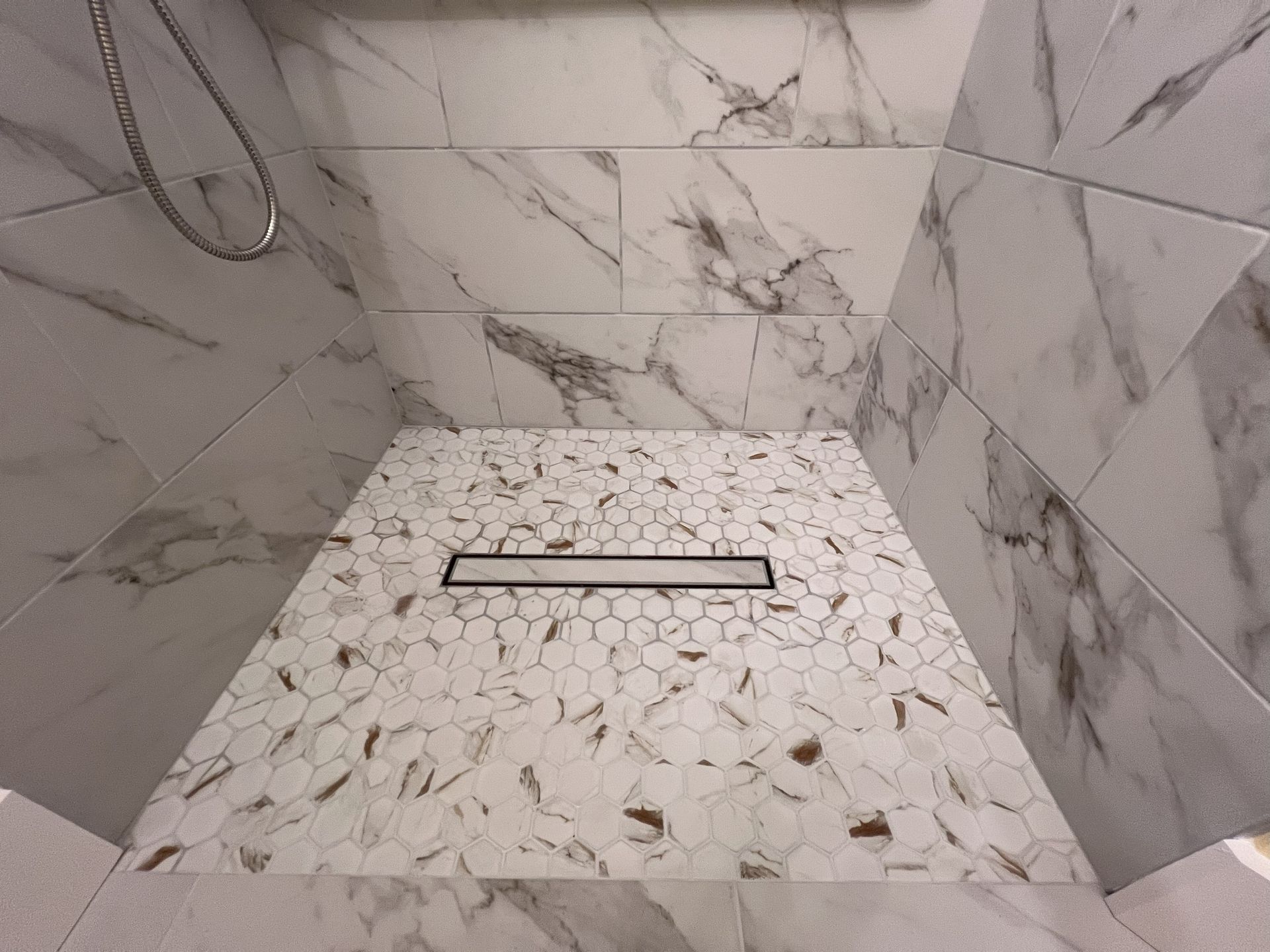 A living room with a couch , coffee table , and rug.