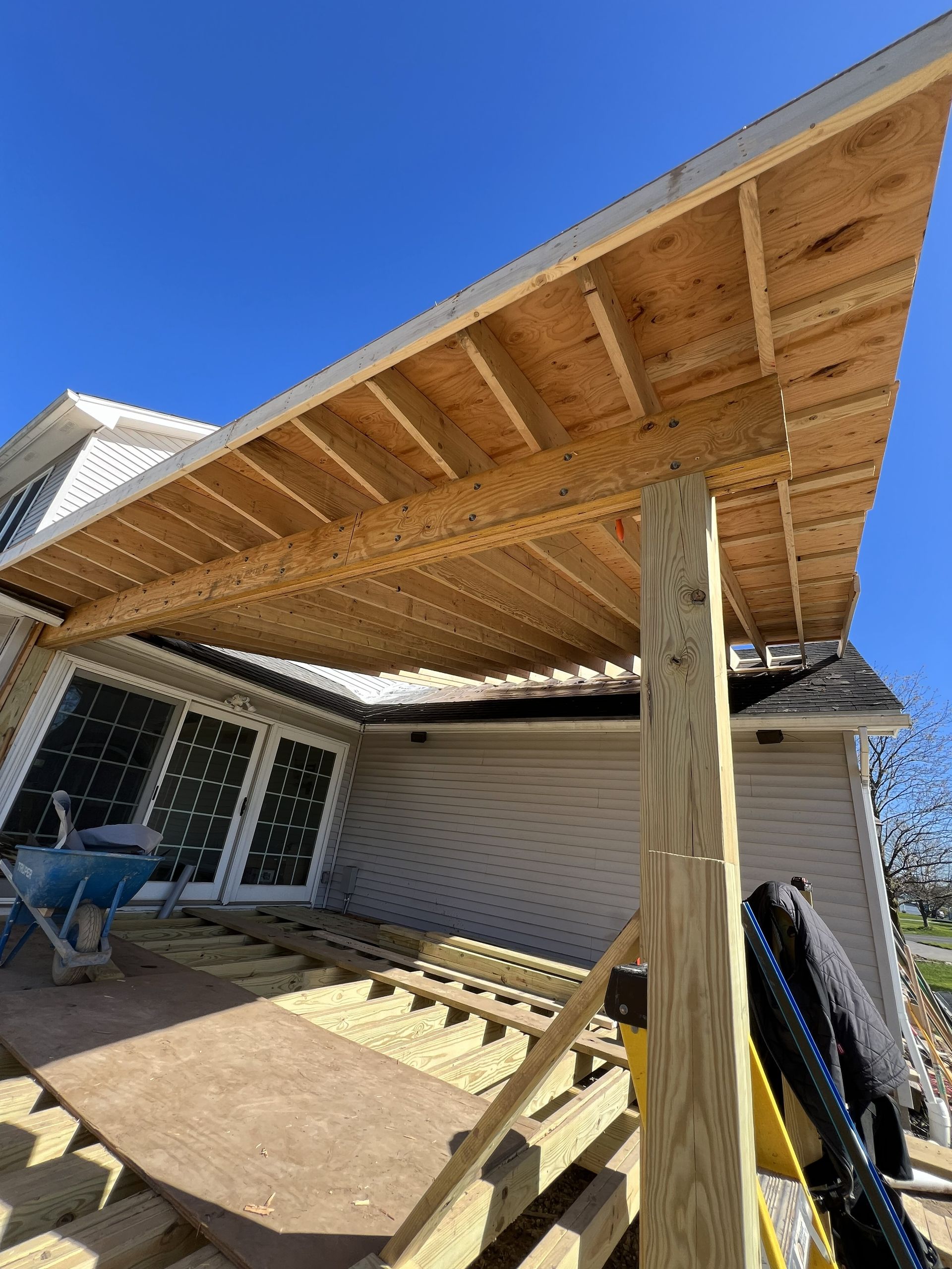 A walk in closet with lots of shelves and drawers