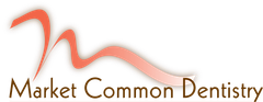 A logo for market common dentistry with a pink ribbon