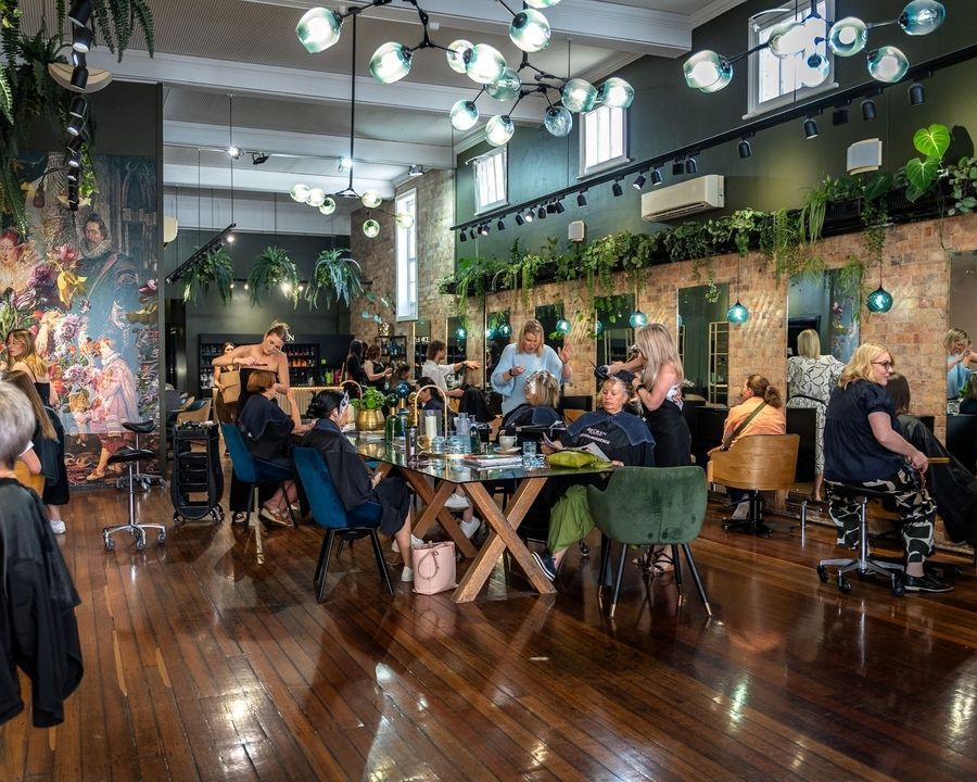 A Group of People Are Getting Their Hair Washed in a Salon — Air Hair Studio in Toowoomba City, QLD