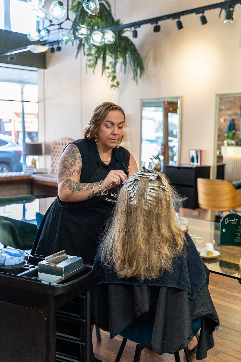 A Woman is Getting Her Hair Dyed in a Salon  — Air Hair Studio in Toowoomba City, QLD