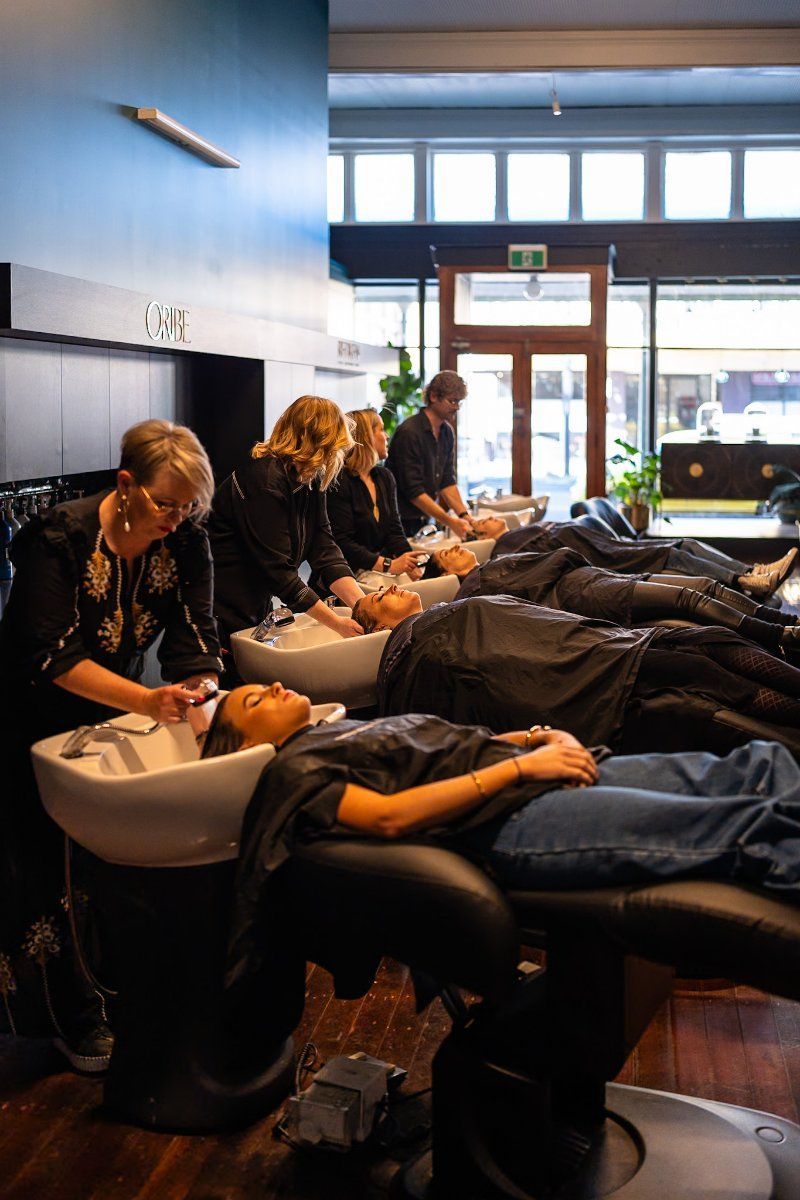 A Woman is Getting Her Hair Dyed in a Salon — Air Hair Studio in Toowoomba City, QLD