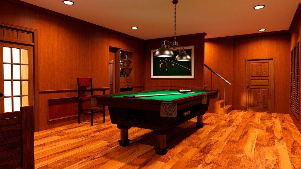 There is a pool table in the middle of the room.