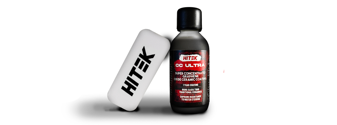 White rectangular Hitek cleaner and a bottle of black liquid.