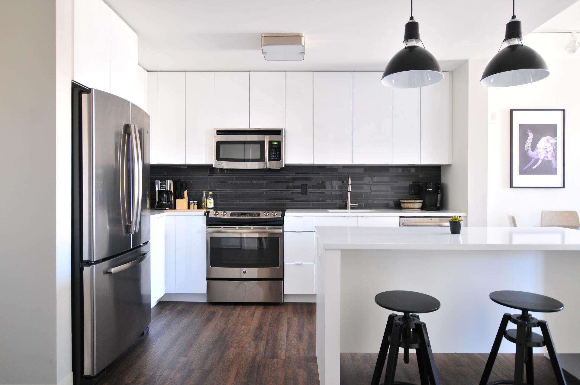minimalist kitchen with fridge and black chair
