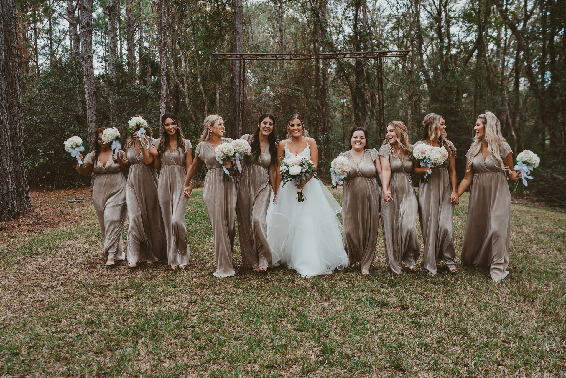 bride walking with bridesmaids