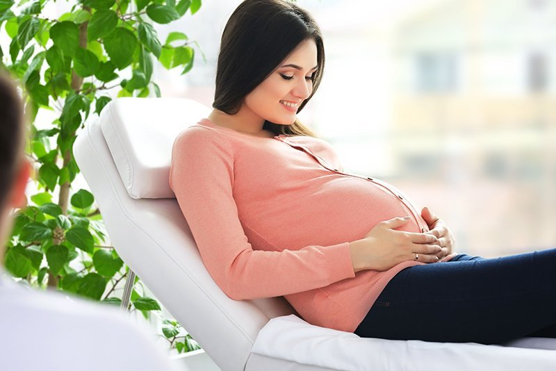 Pregnant woman smiling