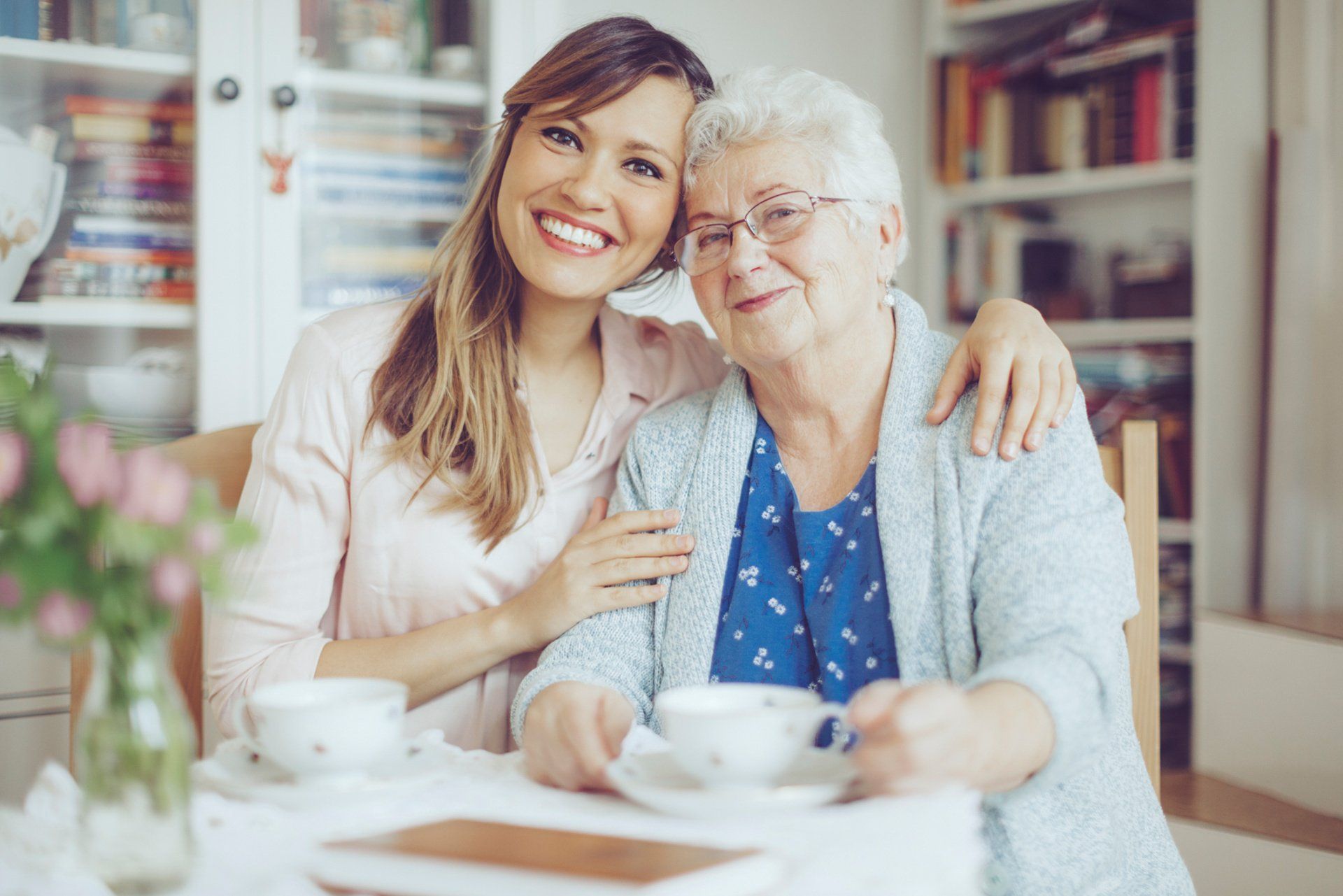 young woman beside elder woman