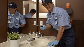 man fixing faucet