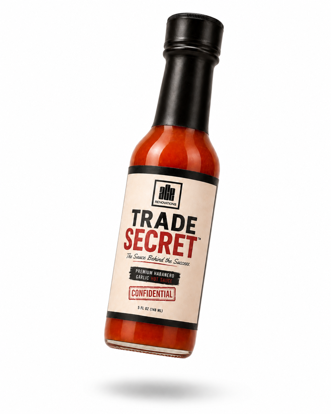 Bottle of Trade Secret bourbon with black cap and cream label, tilted on a white background