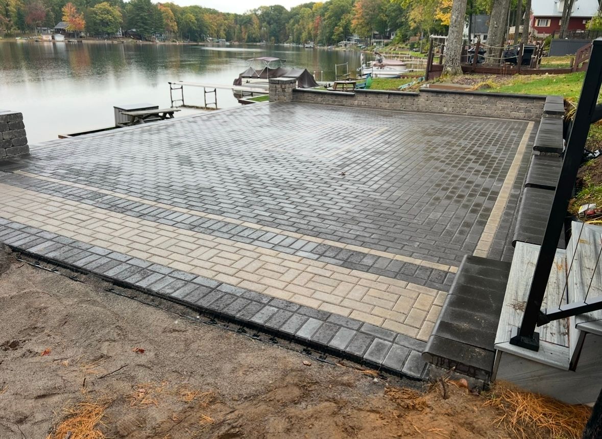 A brick house with a porch and black shutters