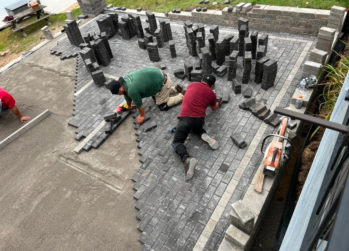 A man and a girl are running in front of a house.