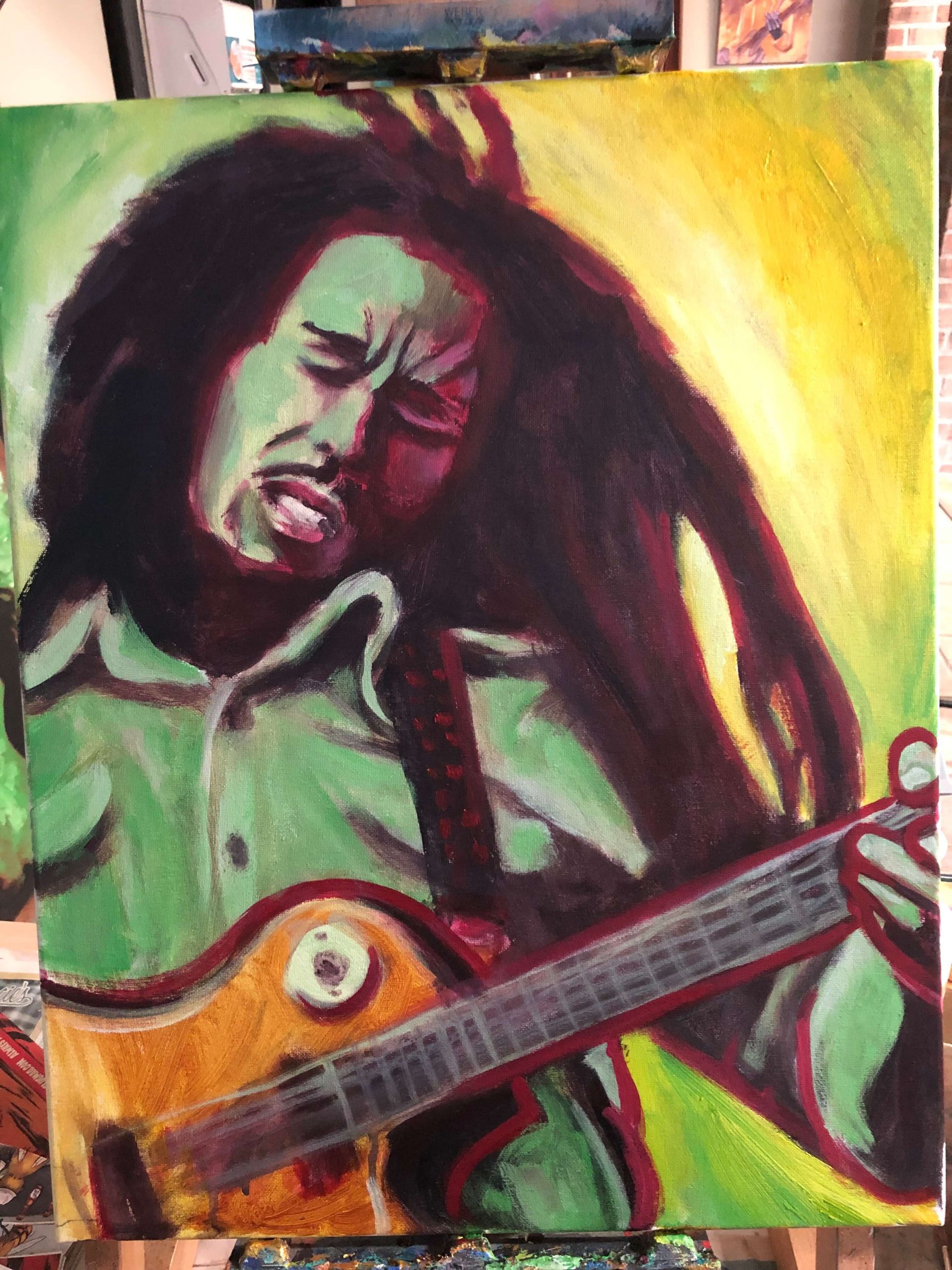A painting of bob marley playing a guitar