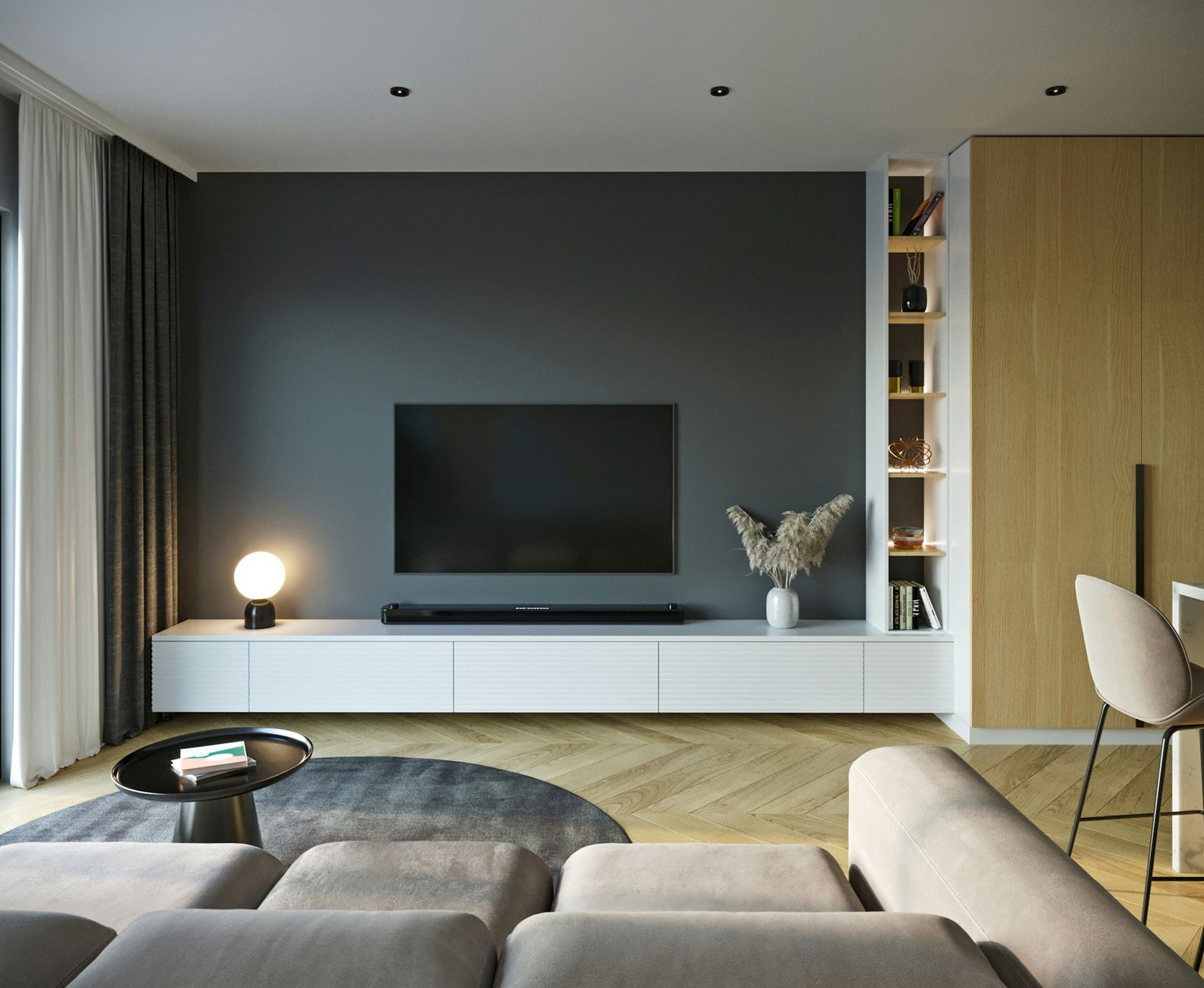 Modern living room with dark gray accent wall, built-in white media console, and wood flooring.