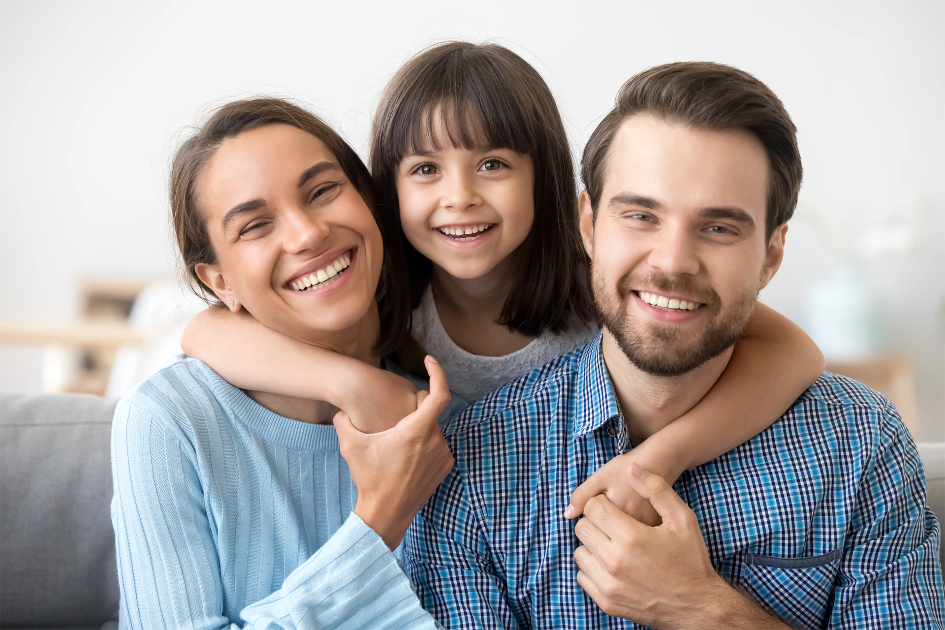 Hispanic family father, mother, and two children enjoying each others company