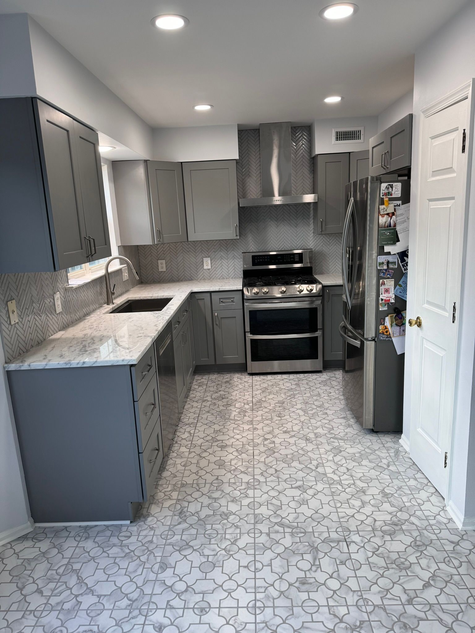 A kitchen with a large island in the middle of the room.