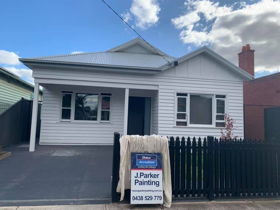 home exterior with company branding board