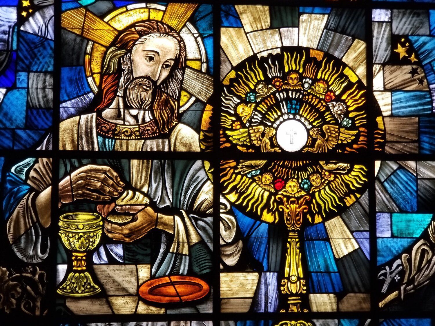 A stained-glass window shows the eucharist