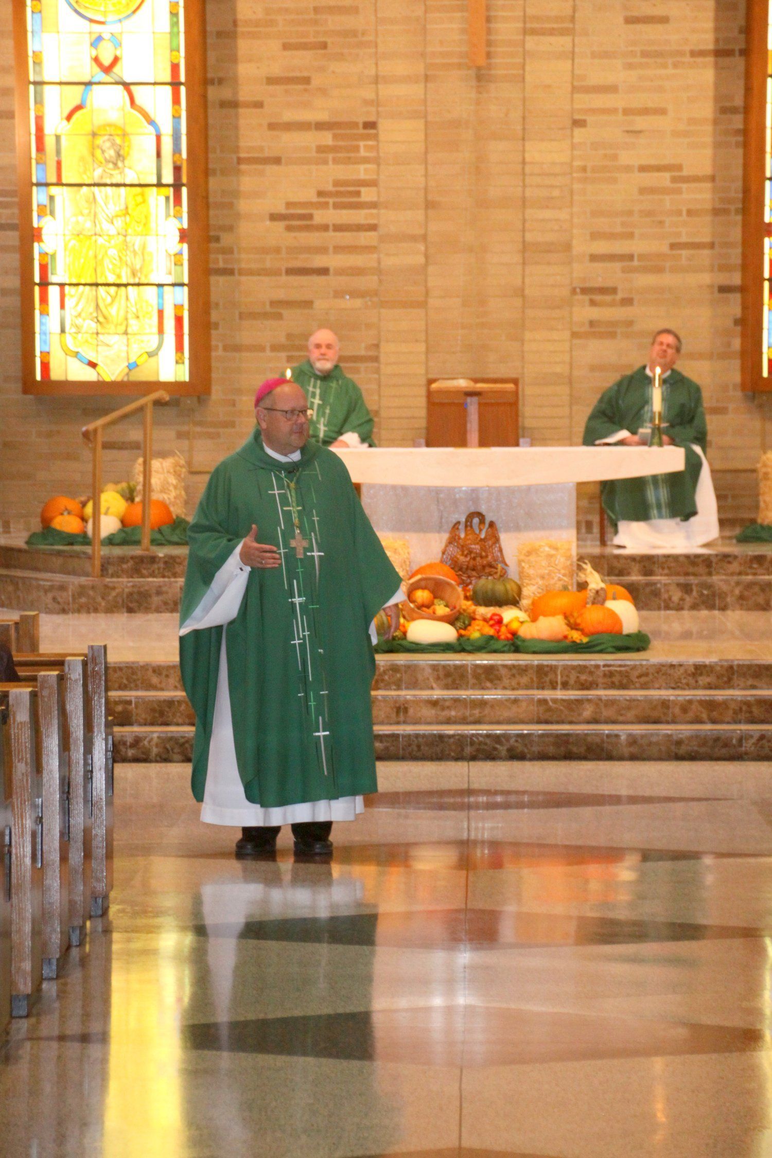 the priest is giving a homily 