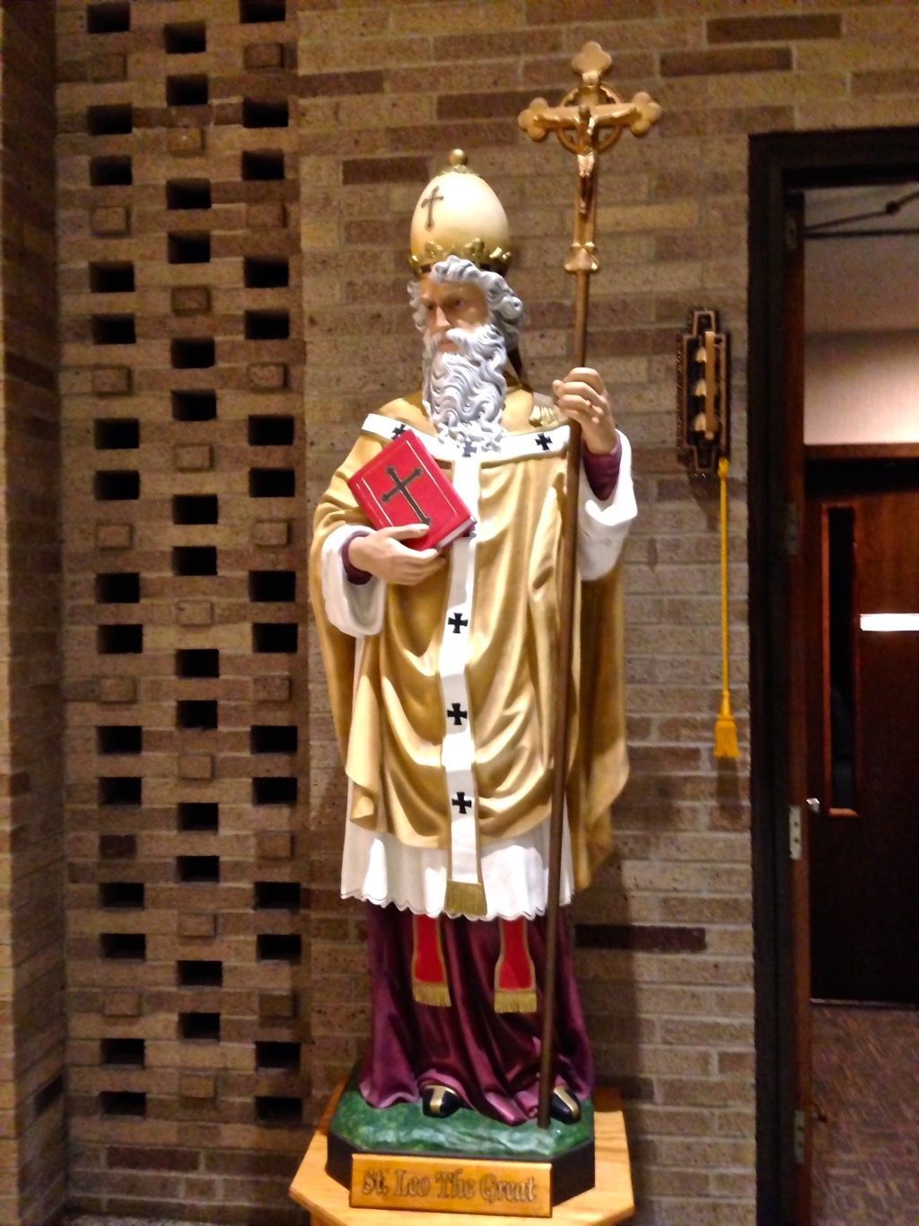 A statue of St. Leo the Great holding the bible and a staff