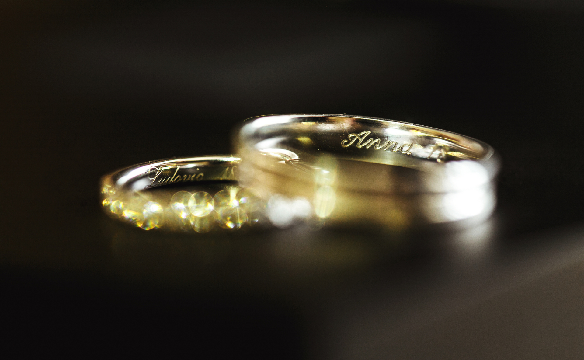 A gold necklace with a diamond pendant is on a mannequin.