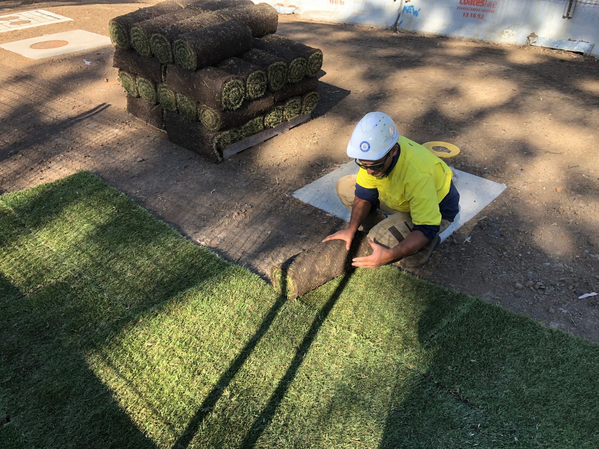 The image of a professional doing buffalo grass installation in Sydney
