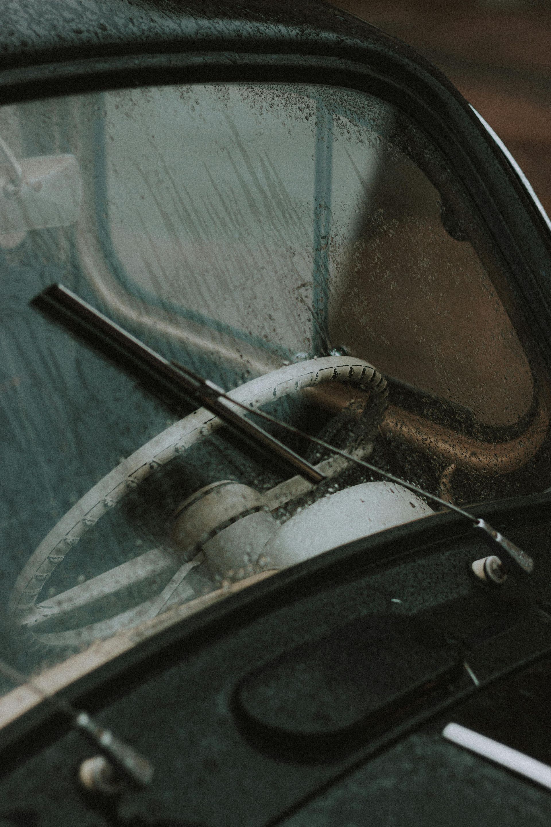 exterior view of damp windshield and wiper