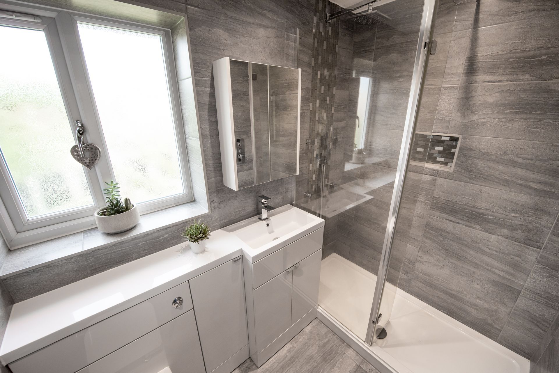 Property bathroom interior with shower glass doors