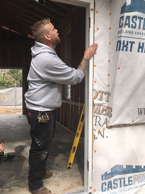 Man Installing Frame for Glass Door — Gulfport, MS — Dunaway Glass