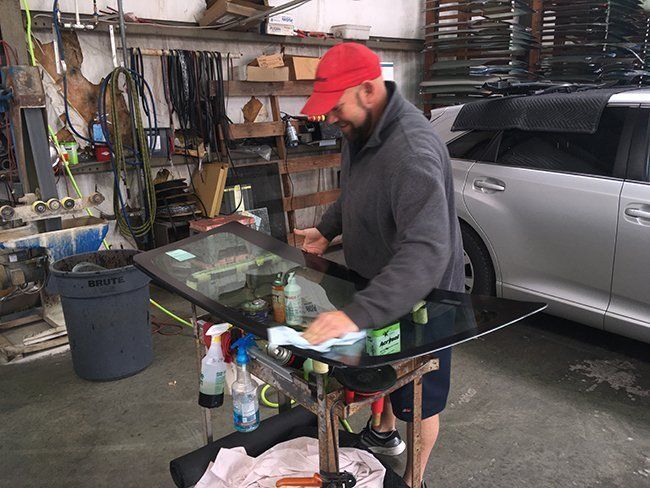 Man Polishing the Glass — Gulfport, MS — Dunaway Glass