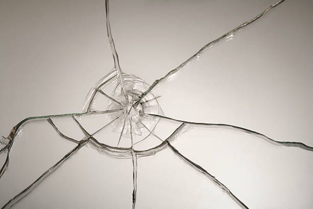 A close up of a broken glass on a white surface.