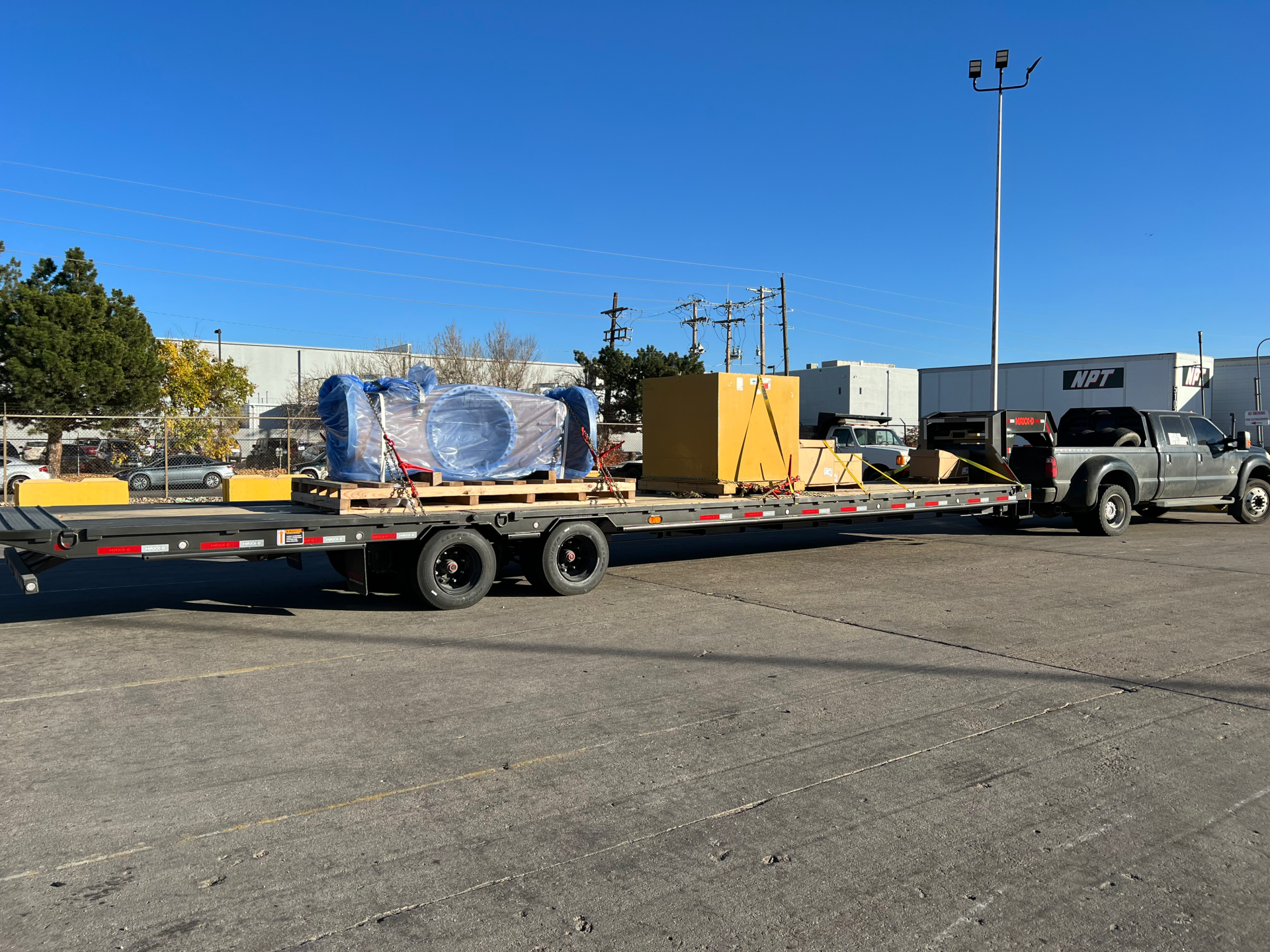 construction and building equipment being hotshot hauled by haul3d