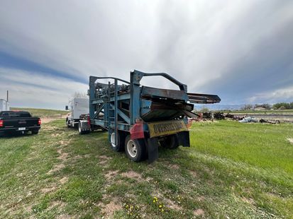 Gooseneck trailer hauling classic cars 