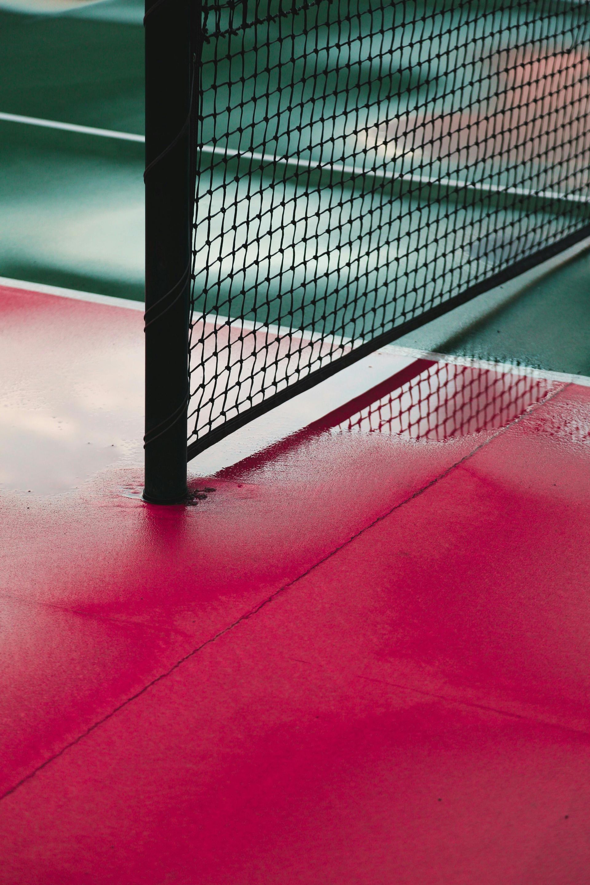 A collage of four pictures of a roof with trees in the background.