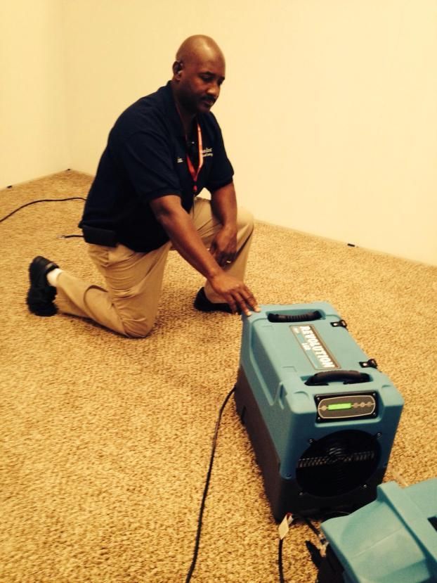 A Man Kneeling Down the Floor - Chesapeake, VA - Fresh Start Commercial Cleaning 