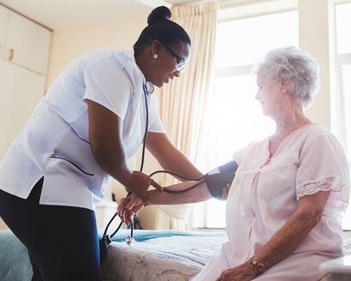 Caregiving — Nurse Checking Blood Pressure of a Patient Upper Darby, PA