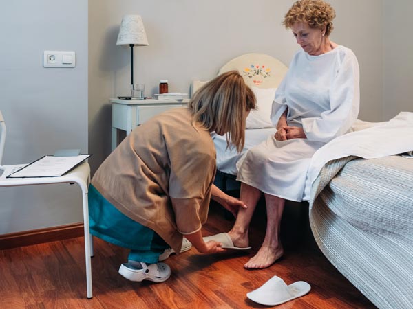 Home Caregiving — Patient Being Assisted by a Nurse in Upper Darby, PA