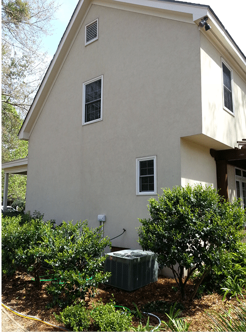 Power washing a house