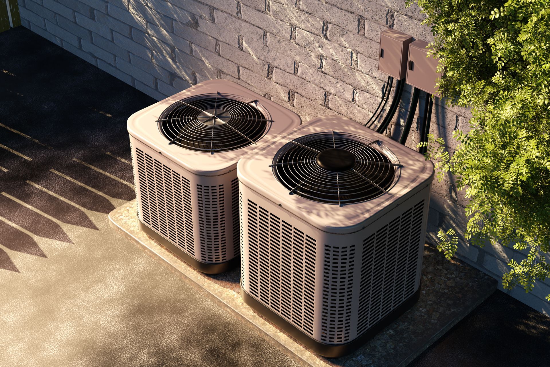 Two outdoor air conditioning units on gravel next to a wooden wall.