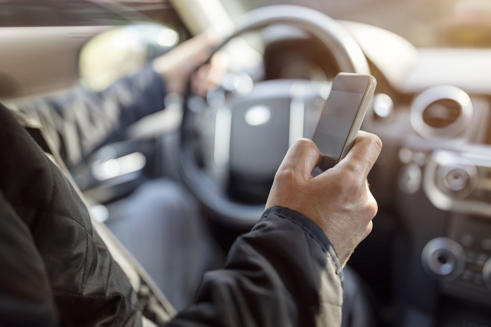 Man Driving While Texting — Watkinsville, GA — Law Offices of Eric K. Krasle