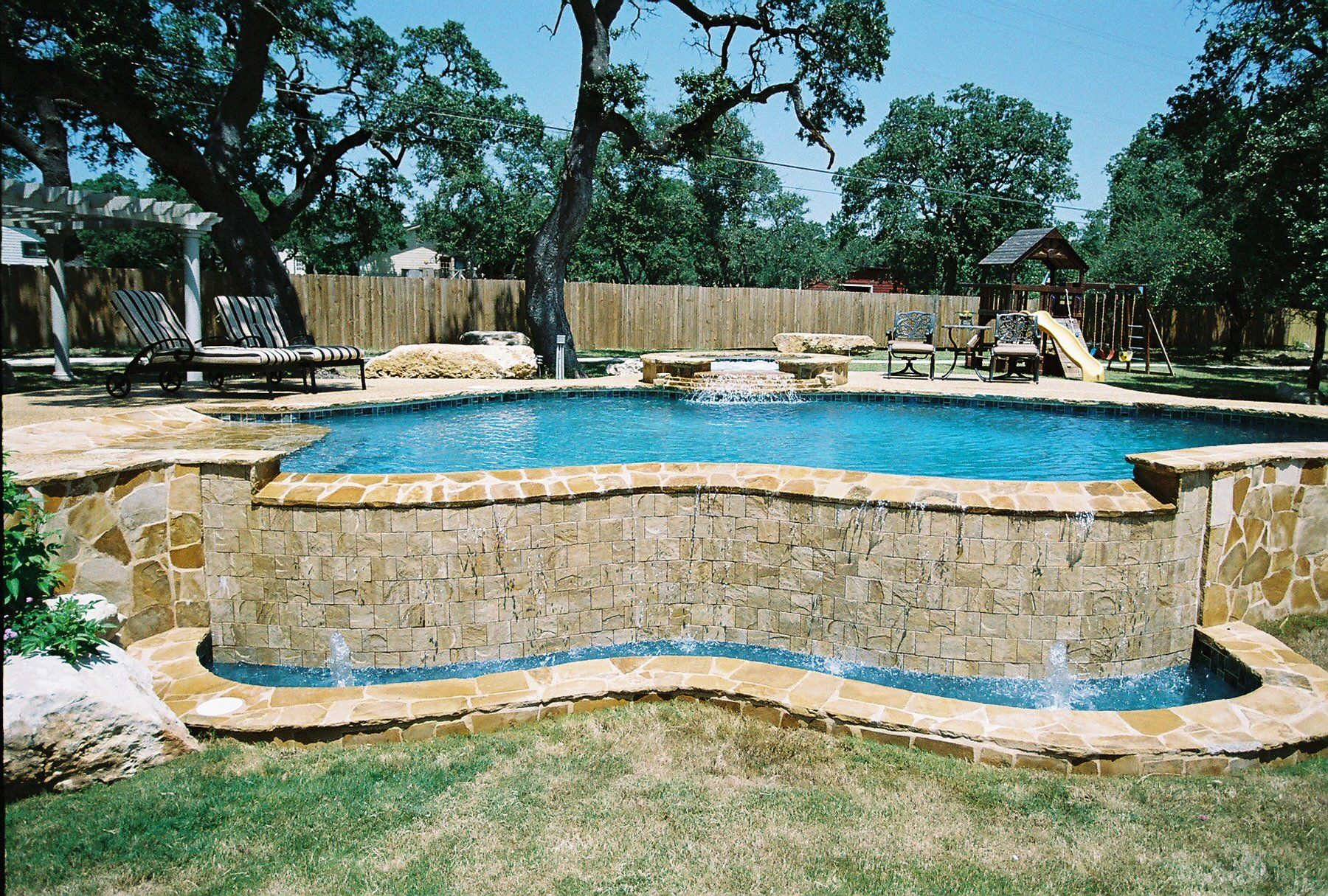 Custom Pool — Beach Chair Beside Swimming Pool in San Antonio, TX