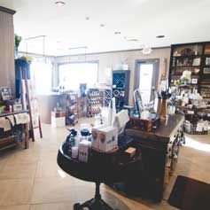 There is a table in the middle of the room with a lot of items on it.