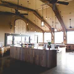 There is a large wooden island in the middle of the room.