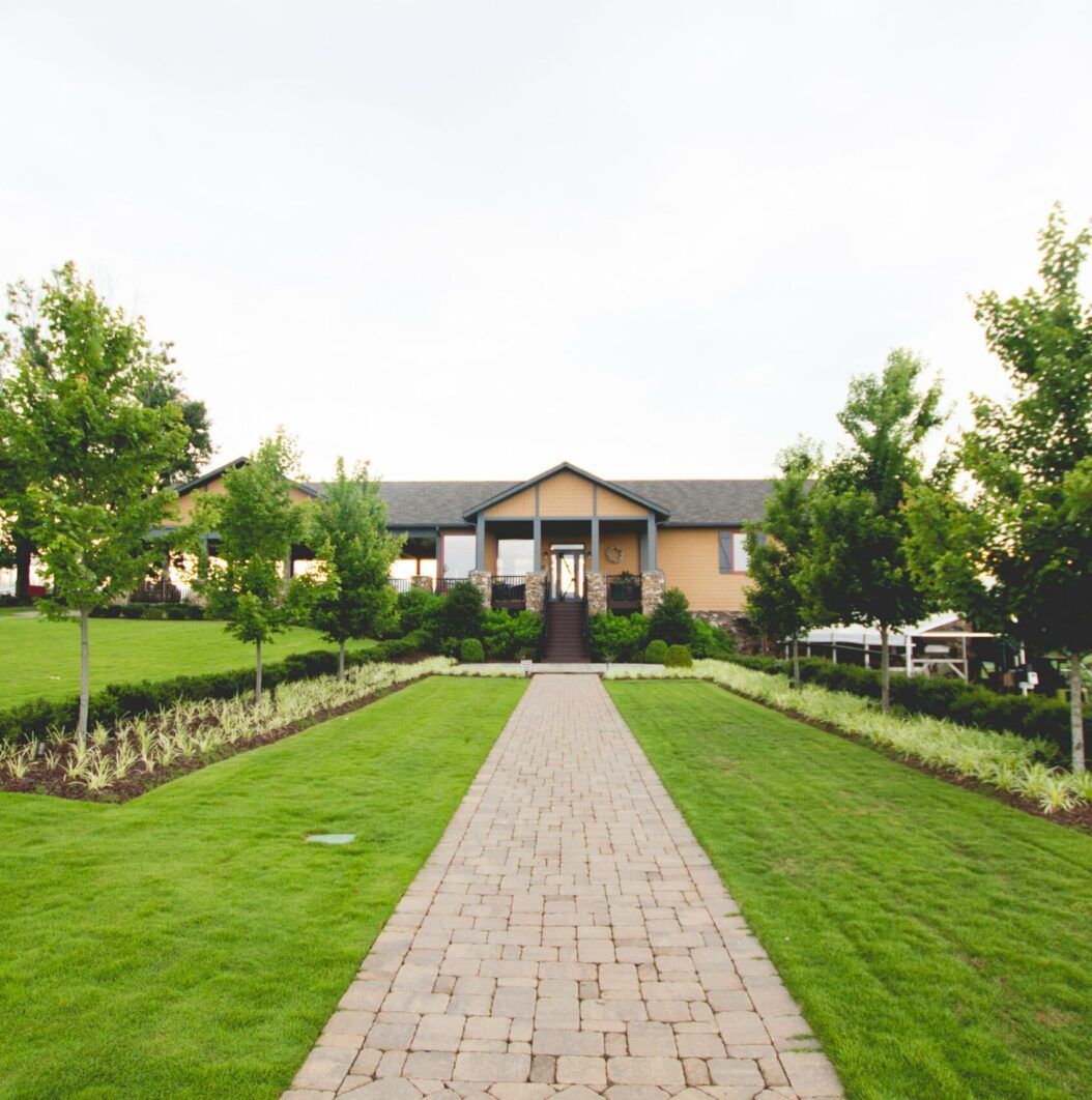 A house with a brick walkway leading to it